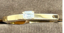 Badra ring in yellow gold and emerald cut diamond
